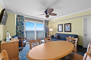 Living room with sleeper sofa, flat screen TV and amazing ocean views