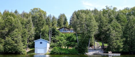 A view of the cottage and dock from out on the lake.