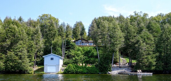 A view of the cottage and dock from out on the lake.