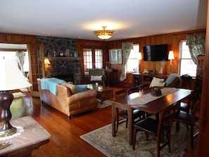 Living room. Leather sofa, 2 arm chairs, flat screen TV, Games, puzzles, books..