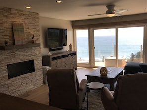 70" television and fireplace to help you feel at home while ocean gazing.
