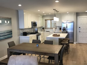 distressed hard wood floors throughout. Inside dining area and kitchen bar.