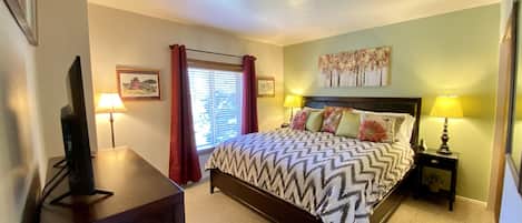 Sunny Master Bedroom with a King Bed, Large Closet, Smart Roku TV & DVD Player.