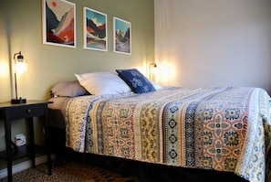 The main bedroom has a comfortable king size bed. 