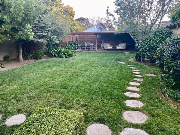 Amazing spacious backyard with BBQ patio and fireplace.   