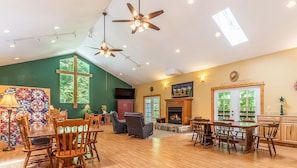 Great room. The living room area is at the back left behind the quilt screen.