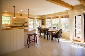 Window and sun-filled dining area.