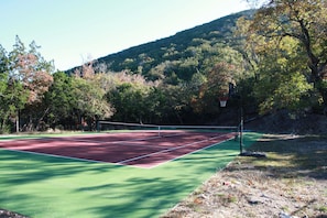 Tennis court and basketball goal