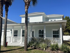 A side view of the home showing sun balcony above the front porch - sun trap!