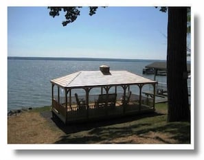 Gazebo sits lake side.