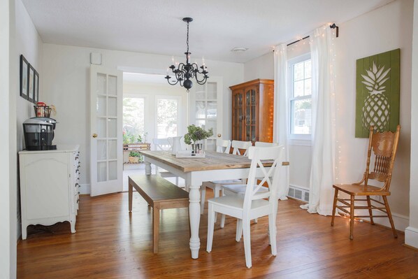 Dining room Table seats 8.
More seating with TV tables and adjacent living room.