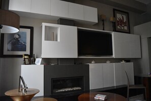 Flat Screen TV and Fireplace in Living Room

