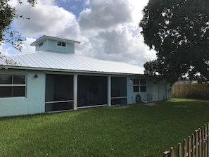 fenced Back Yard & 50-year-old Mango tree!