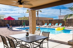 2nd covered patio with ceiling fans, table seats 6, plus seating at outdoor bar.