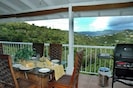 Huge covered Gallery with BBQ, dining, Club chairs and sunset view of St. Thomas