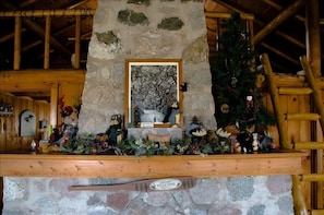 Fieldstone Fireplace with Ladder to Loft