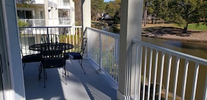 Large balcony overlooking lagoon and 8th green of the magnolia golf course.