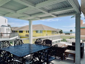 Pergola shades high table. View of the Gulf!