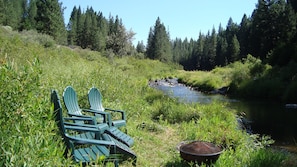 Summertime relaxation at the river, with fire pit for our guests