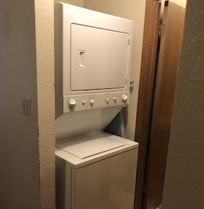 Small washer/dryer unit located upstairs