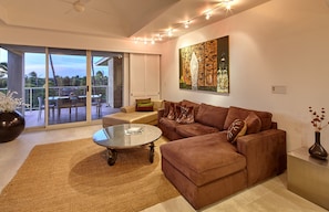 Roomy and plush sectional in the living room doubles as a sleep sofa
