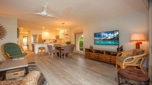 Living room from the sliding glass doors of the lanai.  Kitchen in background.