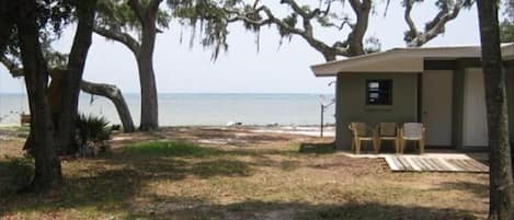 View from the living room window past the main house to the bay