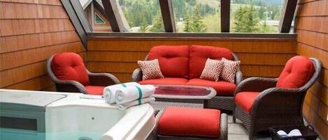 Stunning mountain views from the outdoor living space with six person hot tub and comfy outdoor furniture. 