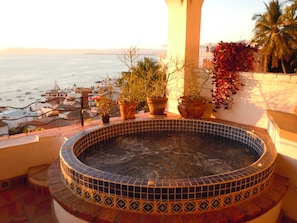 Enjoy the sunset and sweeping bay view from the large heated whirlpool