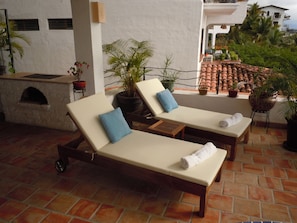 Relax and watch the sunset over the Marietta islands on the lounge chairs
