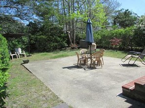 Back patio as seen through large sliding doors.