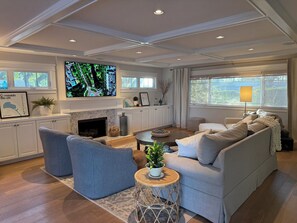 Family room has comfy furniture and a 75in tv (Apple TV, SONOS, etc.)