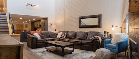 Large airy living room. Sectional with two built-in recliners and sleeper