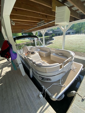BOAT AT YOUR BACK DOOR!!! 22’ Avalon, Seats 11, Tube, Skis, Wake board, Jackets.