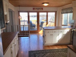 Large kitchen walks out onto 1st floor deck.