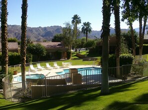 Pool in rear yard greenspace with mountain views