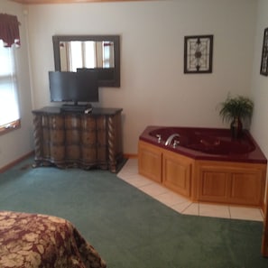 master bedroom with spa tub