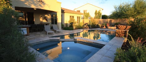 Backyard heaven!  Saltwater pool, spa, fire pit, bar, covered dining for 8. 