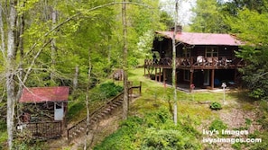 View Taken from across creek to full view of home, sauna bath house and stairs