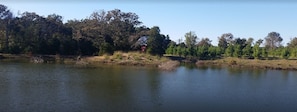 View of one pond, cabin in the background