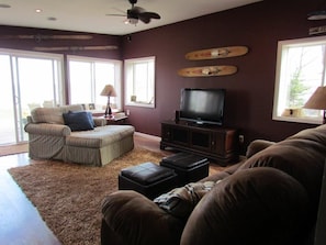 Off the Kitchen is the open area for relaxing, movies, or enjoying the lake view