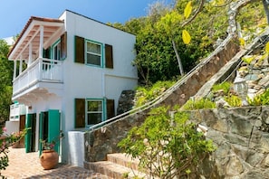 The staircase from the driveway down to the main level w/the guest house