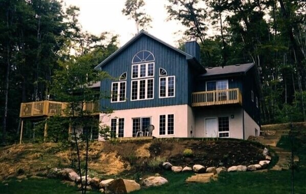 Heritage House viewed from the edge of the woods (lakeside)