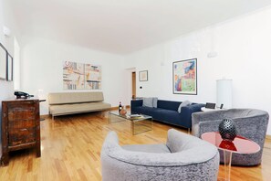 Living room - includes satellite tv, DVD player, Rome-themed DVDs, & iPod dock.