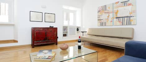 Living room - spacious and light, with modern furniture and beautiful artwork.