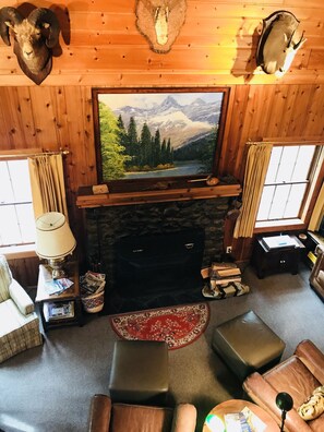 Relax with a warm fire in cozy log cabin after a day of hiking or site seeing