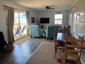 Dining table with four chairs. Couch and two recliners new in 2020.