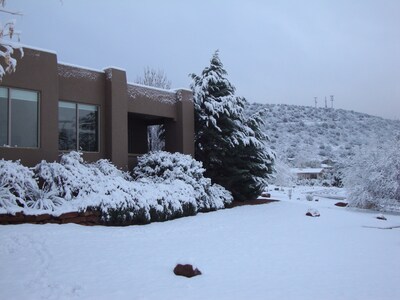 Front of home on a snowy winter day.