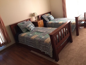 3rd bedroom with 2 twin beds and one trundle bed