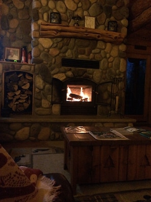 Relax by the fire in Fall/Winter!  Wood provided with log home rental.